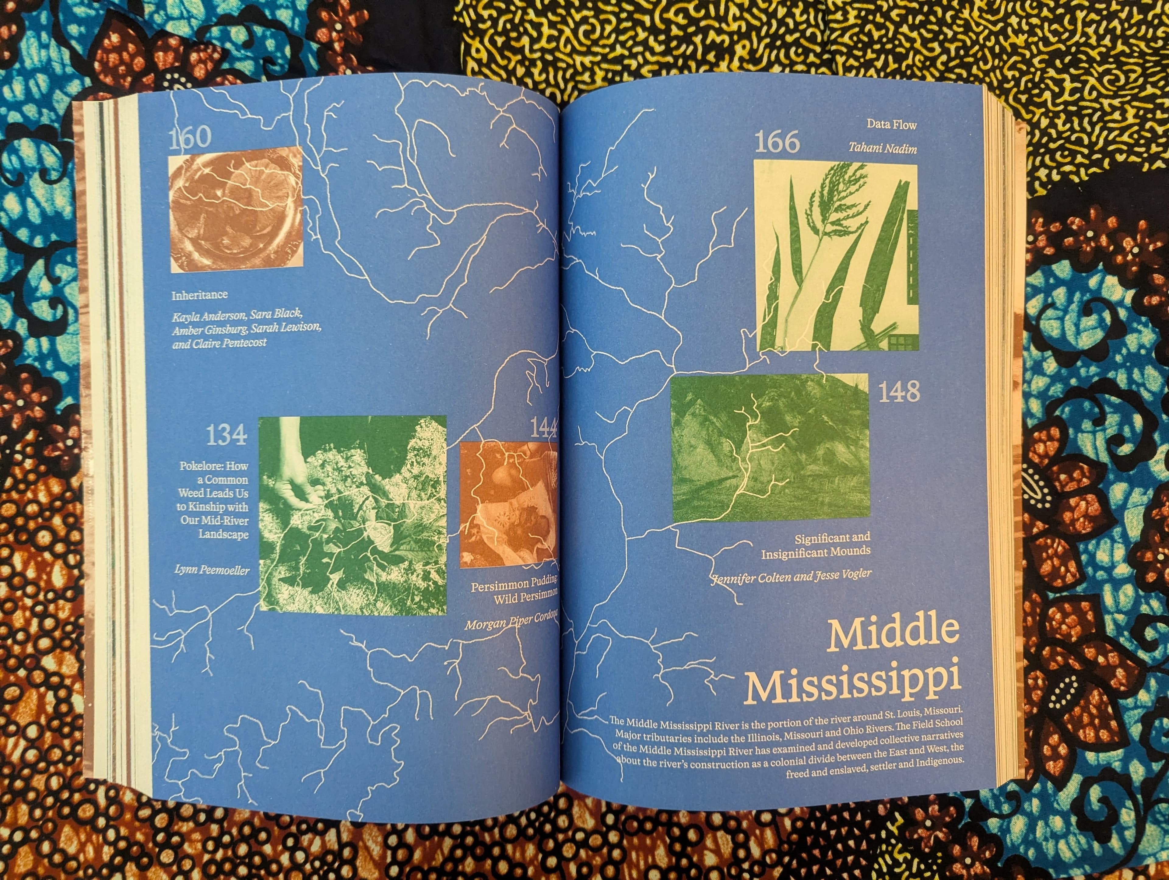 the mississippi river open school book open to a spread featuring an overlook installation photograph